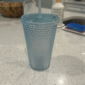 16oz light blue studded overseas Starbucks tumbler.